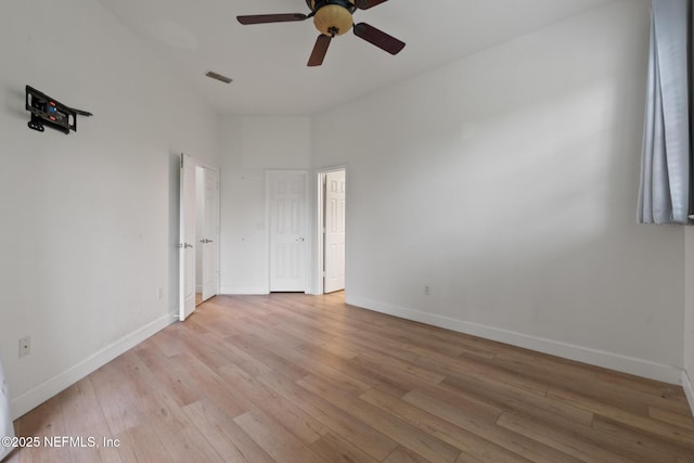 unfurnished room with light hardwood / wood-style floors and ceiling fan