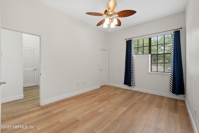 unfurnished room featuring ceiling fan and light hardwood / wood-style floors