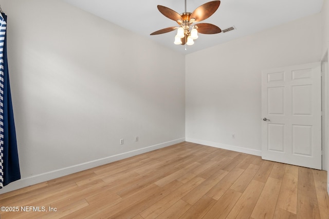 spare room featuring light hardwood / wood-style floors and ceiling fan