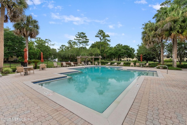 view of pool featuring a pergola and a patio area