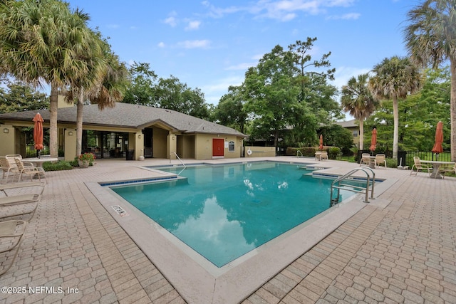 view of swimming pool with a patio area