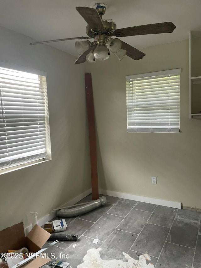 unfurnished room with ceiling fan