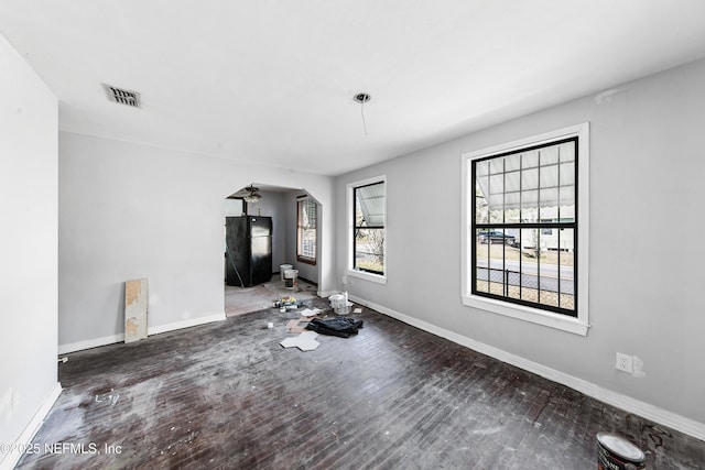 unfurnished living room featuring dark hardwood / wood-style floors