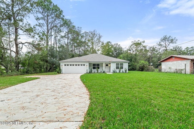 view of front of house with a garage and a front yard