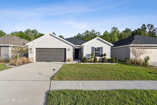 single story home featuring a garage and a front yard