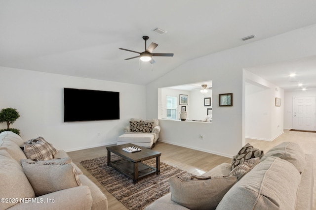 living room with lofted ceiling, light hardwood / wood-style flooring, and ceiling fan