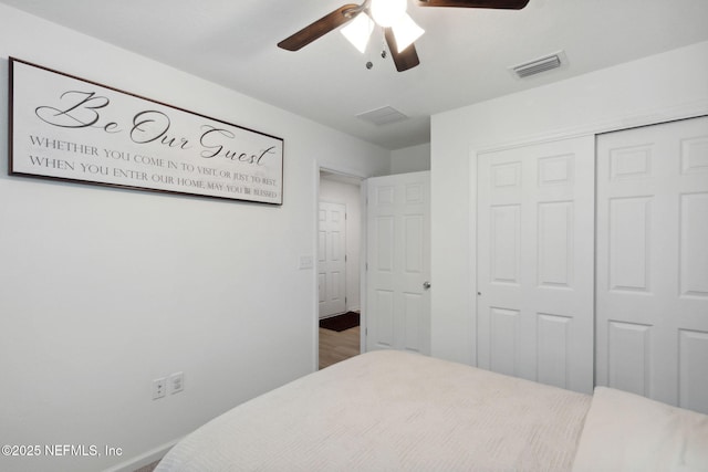 bedroom featuring ceiling fan and a closet