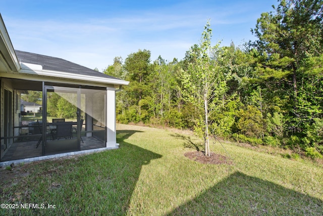 view of yard with a sunroom