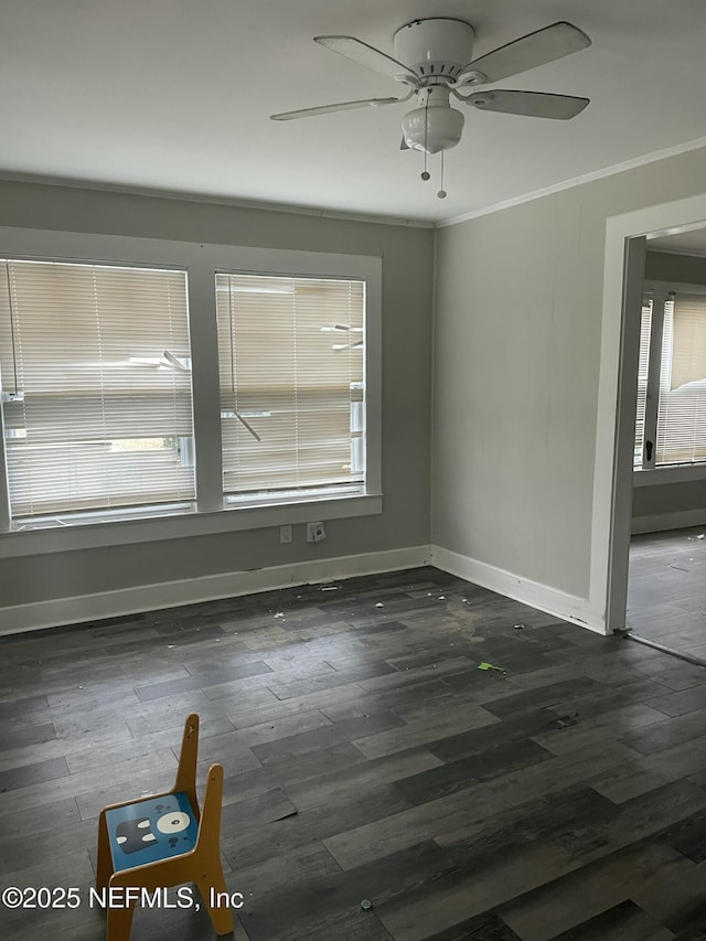 unfurnished room featuring ornamental molding, dark hardwood / wood-style floors, and ceiling fan