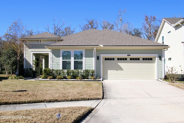 view of front of home featuring a garage and a front lawn