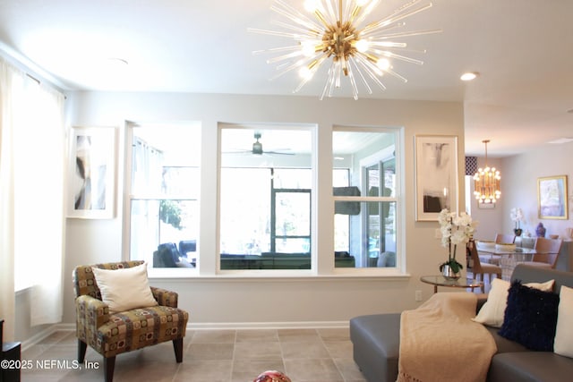 tiled living room featuring a wealth of natural light and a notable chandelier