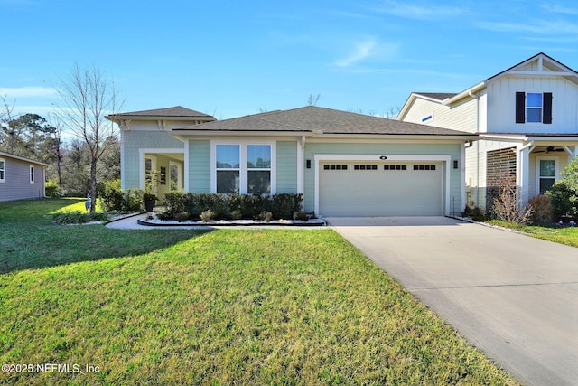 view of front of property featuring a garage and a front yard