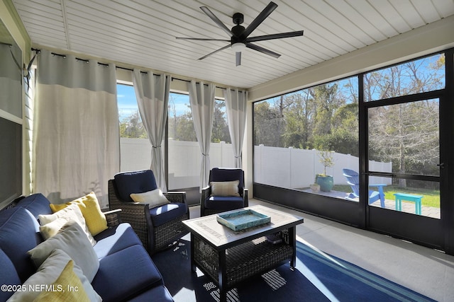 sunroom featuring ceiling fan