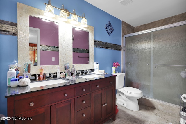 bathroom featuring vanity, backsplash, a shower with shower door, and toilet