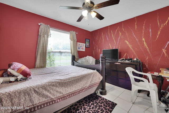 bedroom featuring light tile patterned floors and ceiling fan