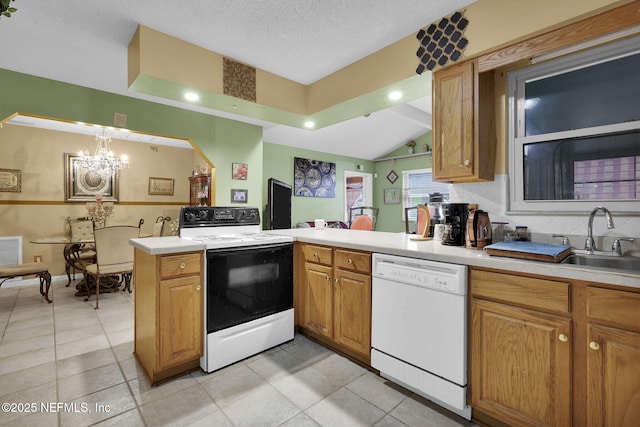 kitchen with dishwasher, electric range, a textured ceiling, decorative light fixtures, and kitchen peninsula