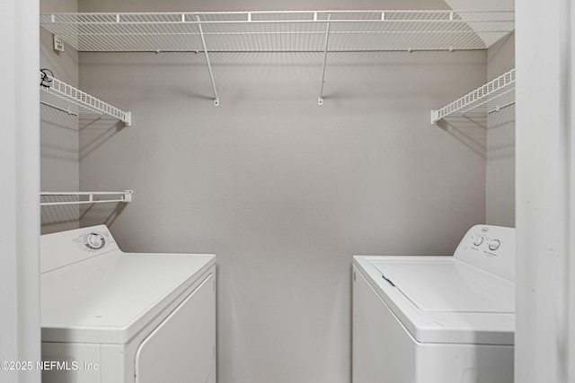 washroom featuring washer and dryer