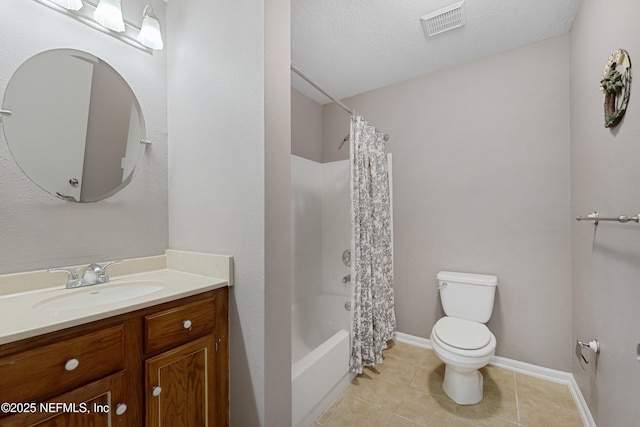 full bathroom with tile patterned floors, toilet, a textured ceiling, vanity, and shower / bath combo with shower curtain