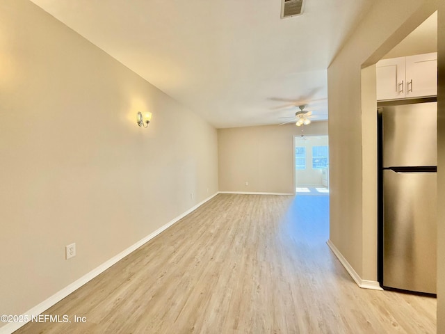 unfurnished room with light hardwood / wood-style floors and ceiling fan