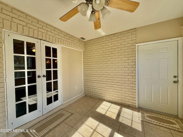 interior space featuring french doors and ceiling fan