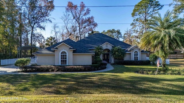 ranch-style home with a front lawn and a carport