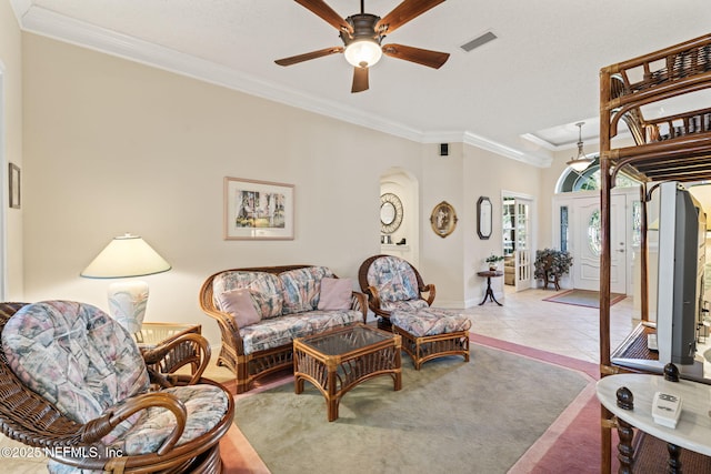 tiled living room featuring crown molding and ceiling fan