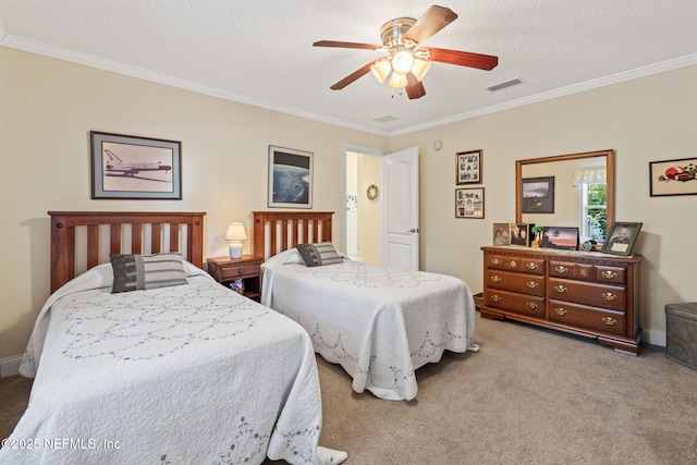 carpeted bedroom with ornamental molding, a textured ceiling, and ceiling fan