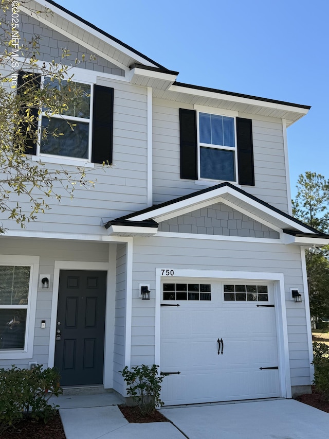 view of front of property with a garage