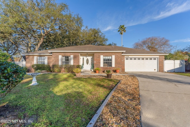 single story home featuring a garage and a front lawn