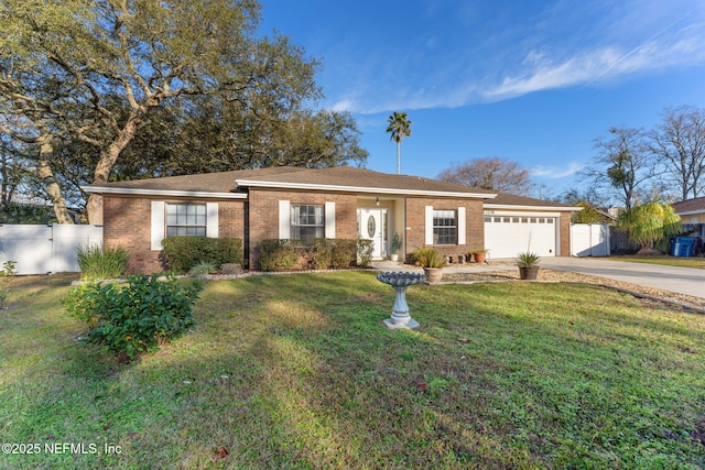 single story home featuring a garage and a front lawn