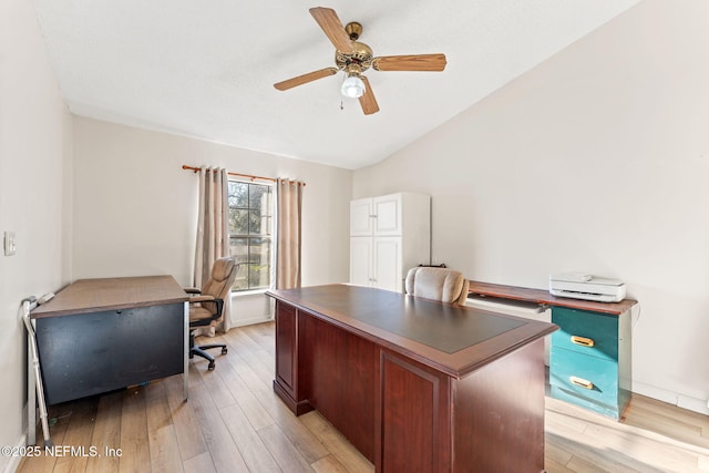 office featuring lofted ceiling, ceiling fan, and light wood-type flooring