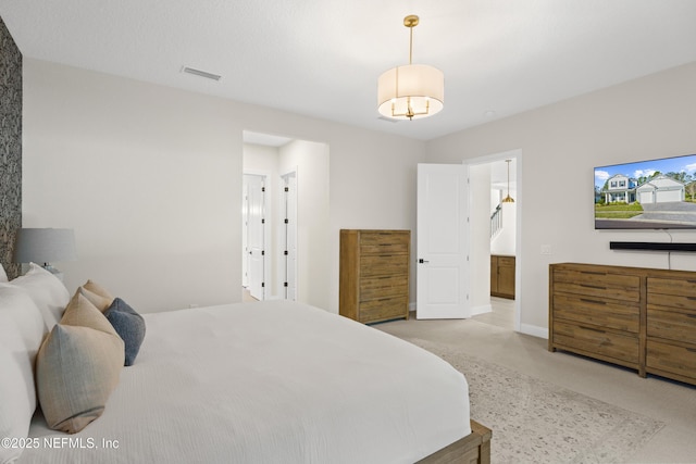 carpeted bedroom featuring baseboards