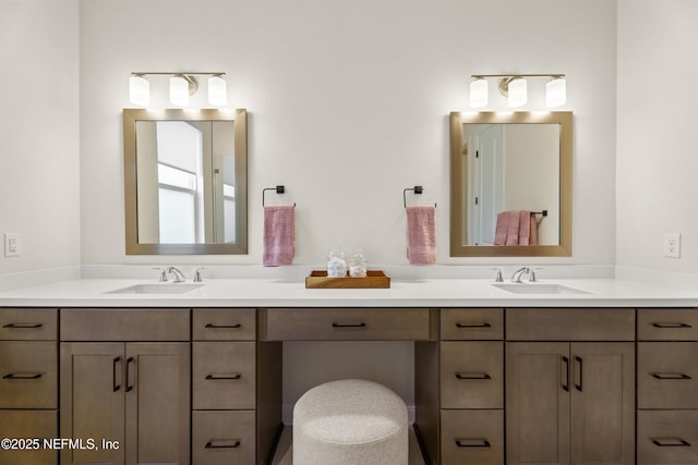 bathroom featuring a sink and double vanity