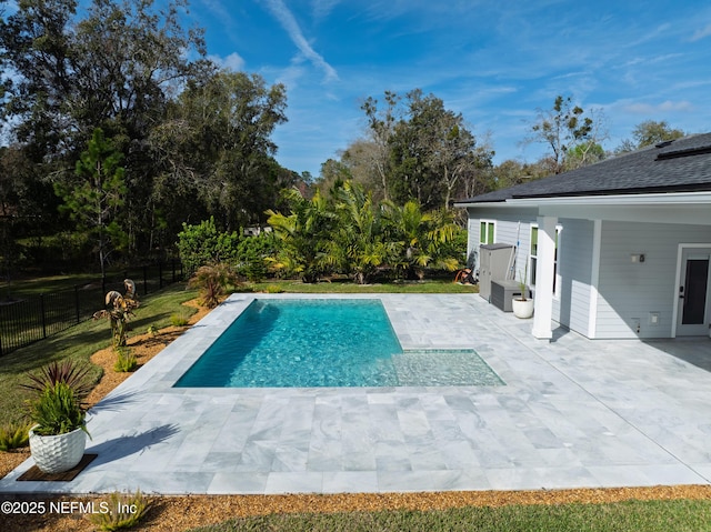 view of pool with a patio area, a fenced backyard, and a fenced in pool