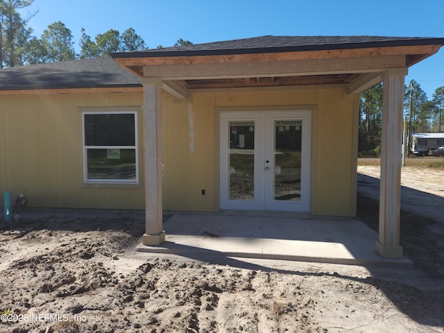 property entrance featuring french doors and a patio