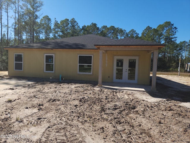 back of house with french doors and a patio