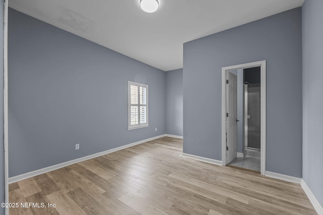 spare room featuring light hardwood / wood-style floors