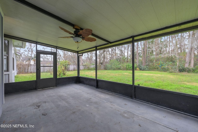 unfurnished sunroom with a wealth of natural light and ceiling fan