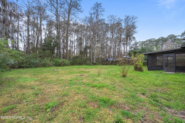 view of yard with a sunroom