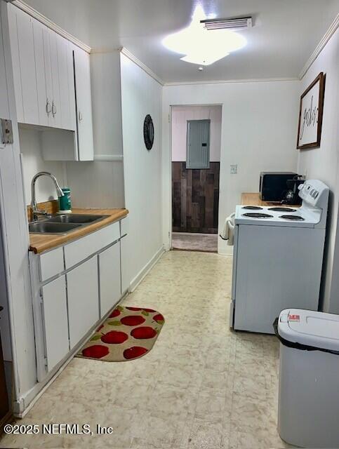 kitchen featuring sink, ornamental molding, white cabinets, and white range with electric cooktop