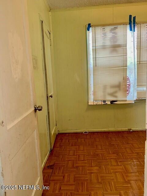 spare room featuring parquet floors