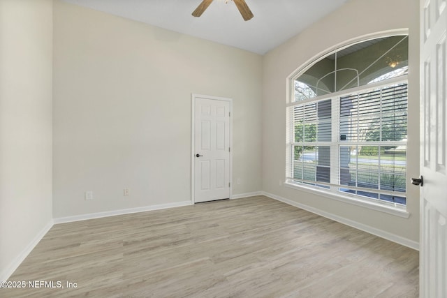 empty room with light hardwood / wood-style flooring and ceiling fan