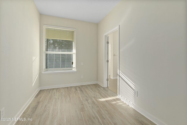 spare room with light hardwood / wood-style floors