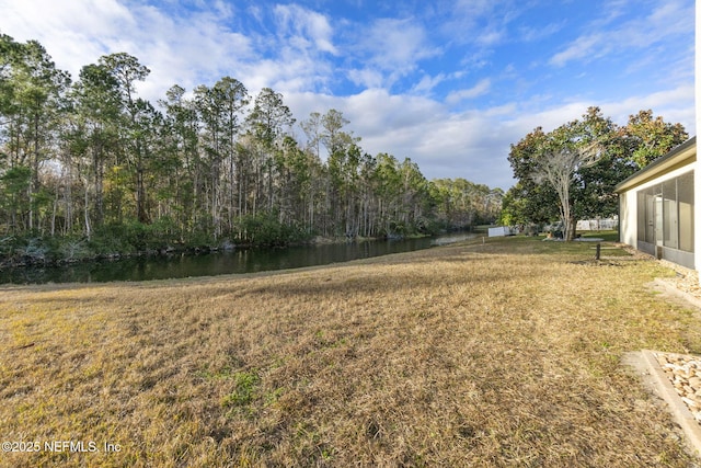 view of yard featuring a water view