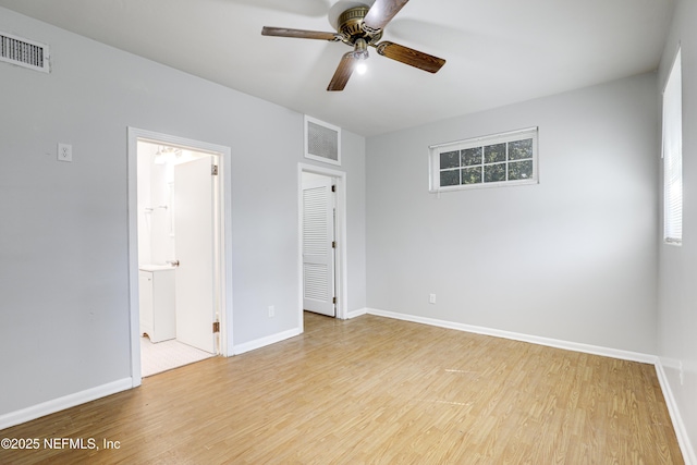 empty room featuring ceiling fan and light wood-type flooring