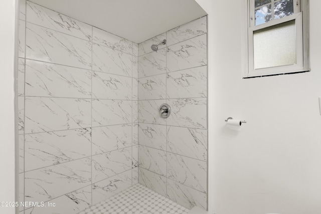 bathroom with tiled shower