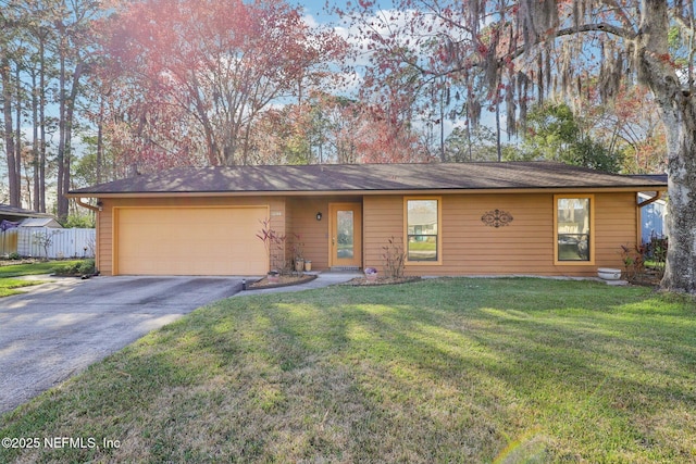 ranch-style home featuring a garage, driveway, a front lawn, and fence