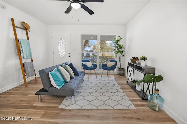 sitting room featuring ceiling fan and hardwood / wood-style floors