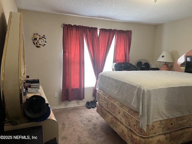 carpeted bedroom with a textured ceiling