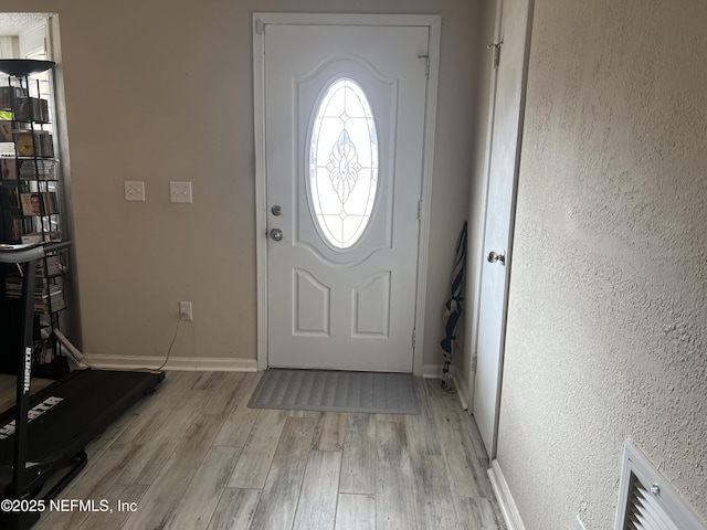 entrance foyer with light hardwood / wood-style flooring